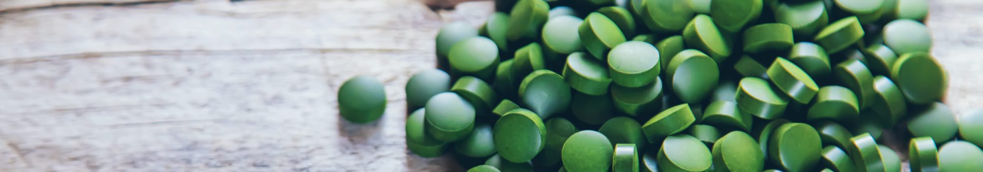 There are many spirulina and chlorella tablets. Selective focus. There are many spirulina and chlorella tablets. Selective focus. nature.